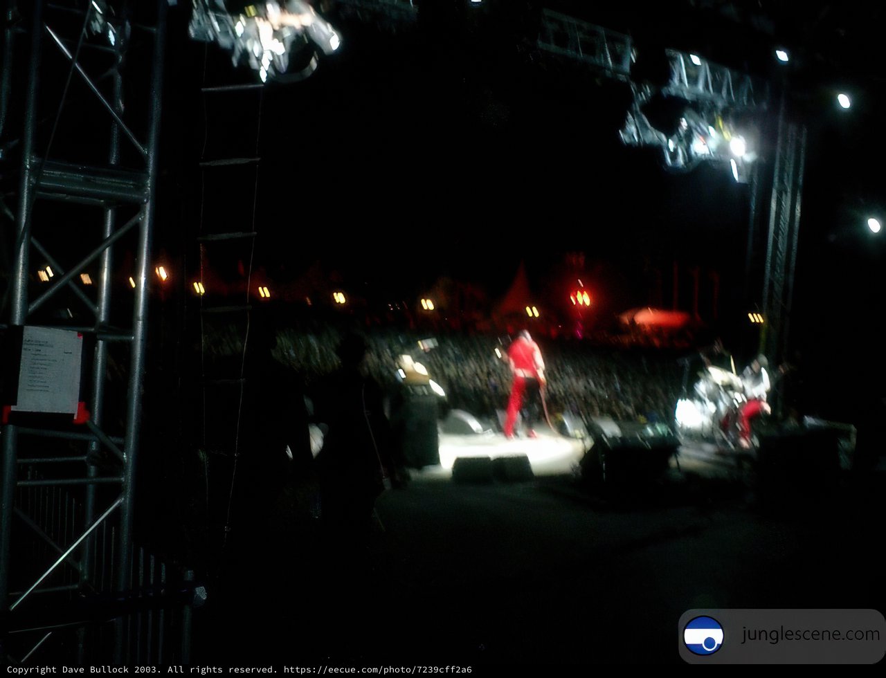 Man in Red on Concert Stage