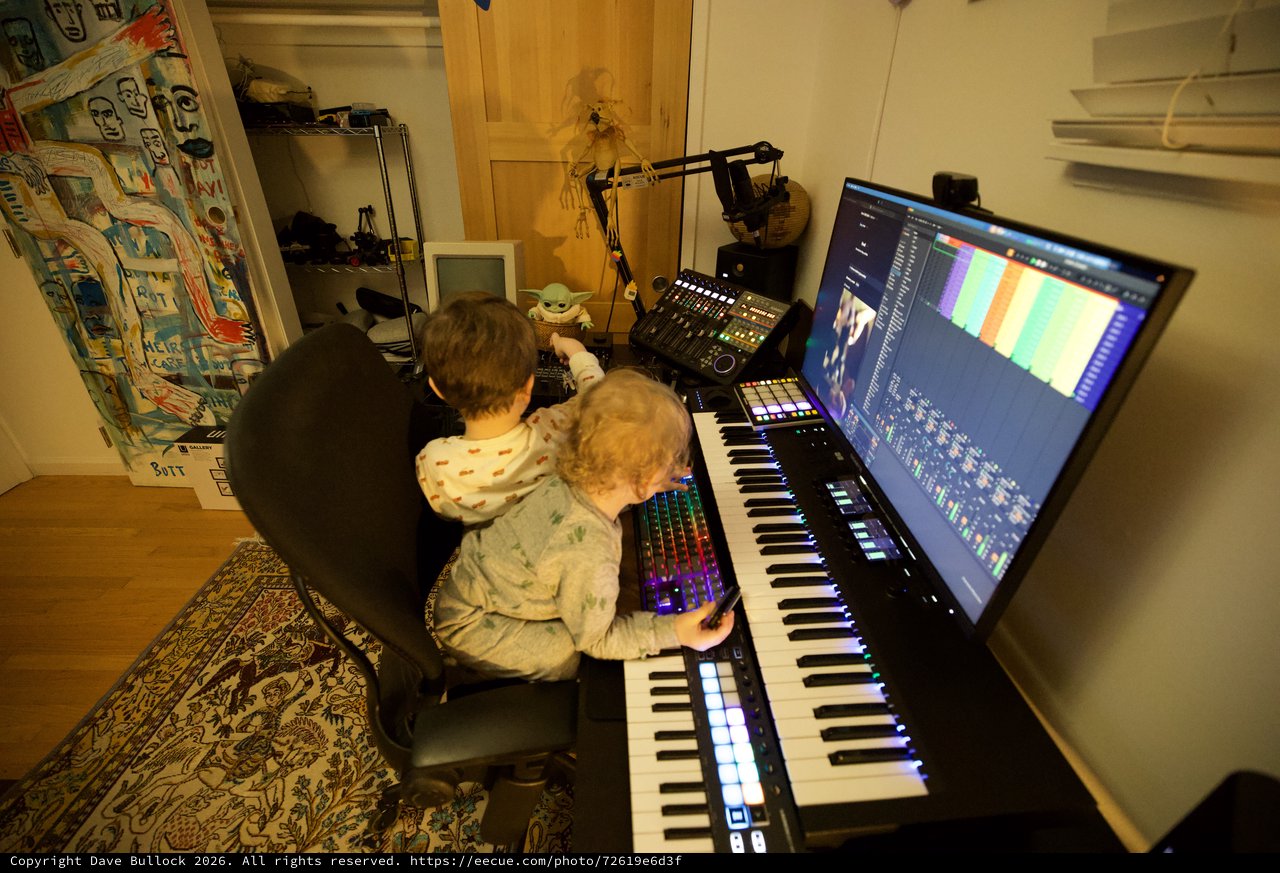 Father and Child Creating Music Together in Home Studio