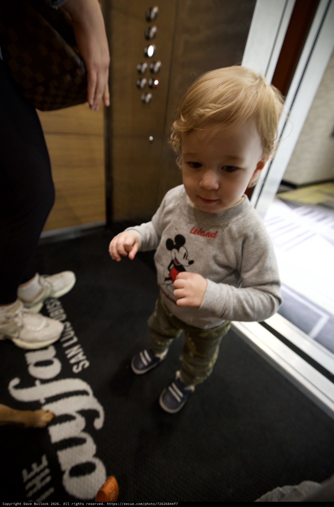 Young Child in Mickey Mouse Shirt in Hotel Elevator