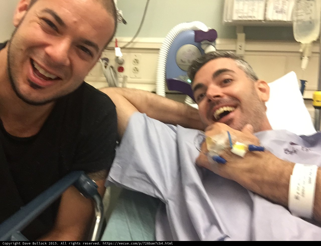 Two Men Smiling in Hospital Beds