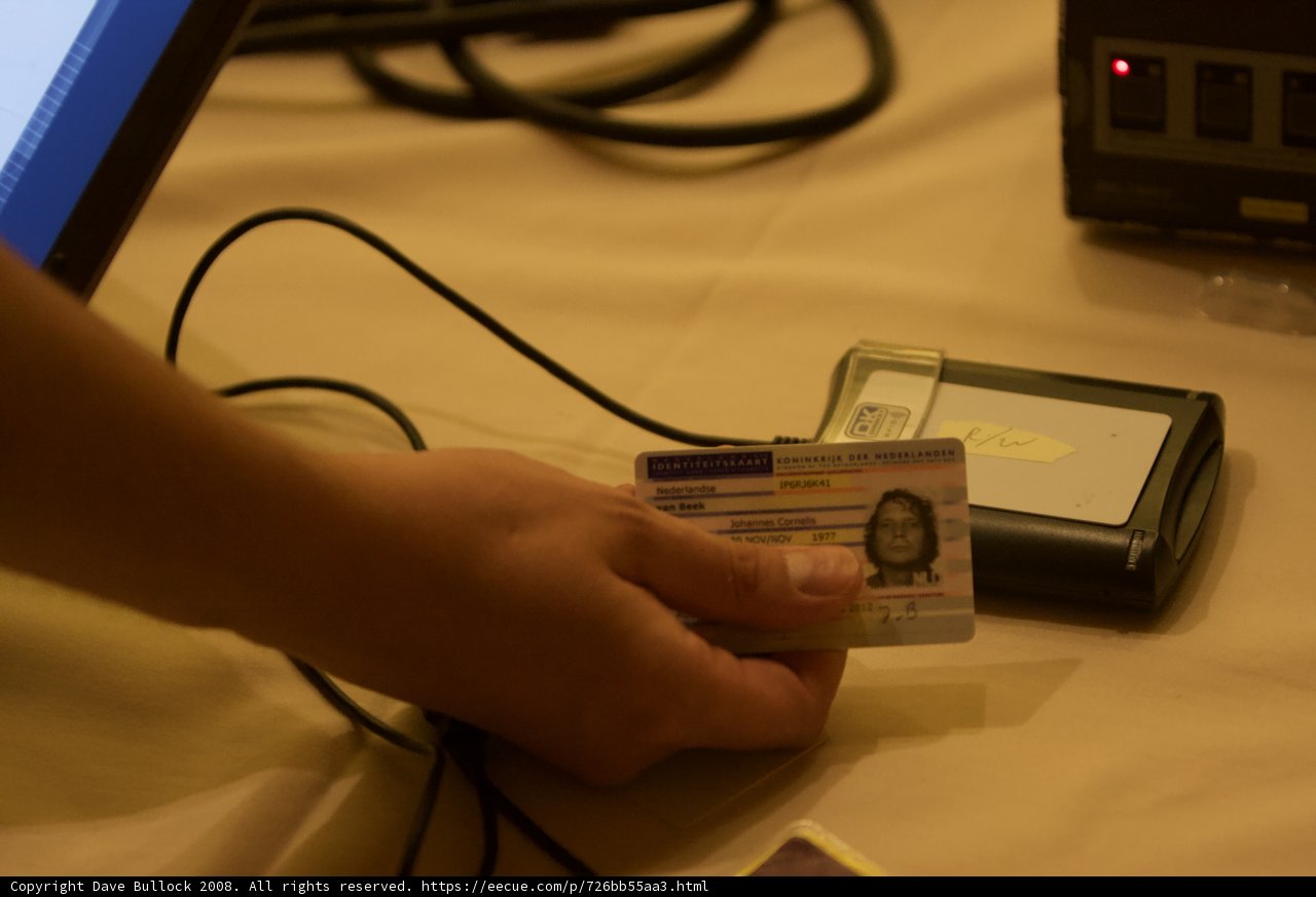 Computer and ID Card in Hand
