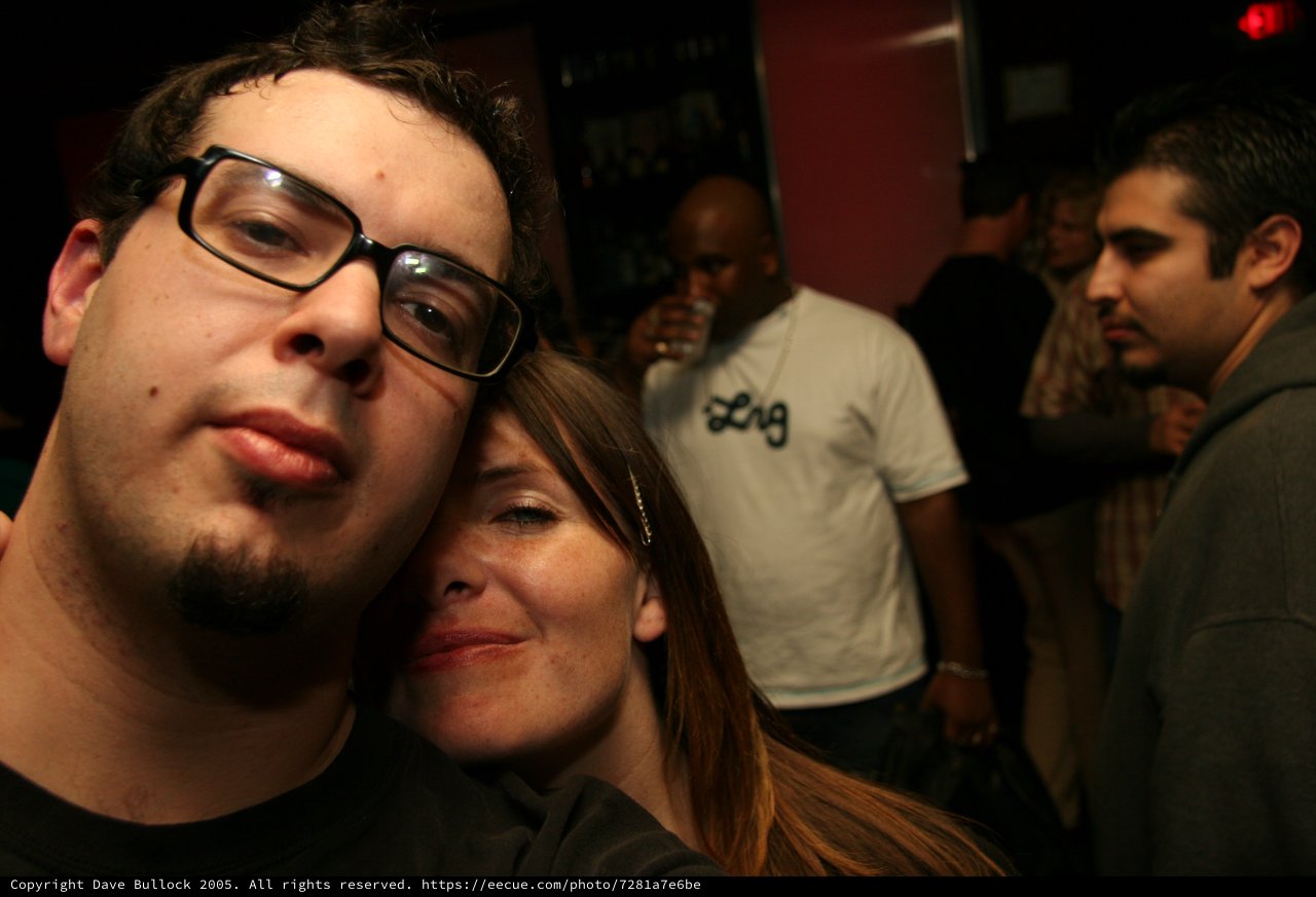 Friends Pose Close Together at Nightclub Party