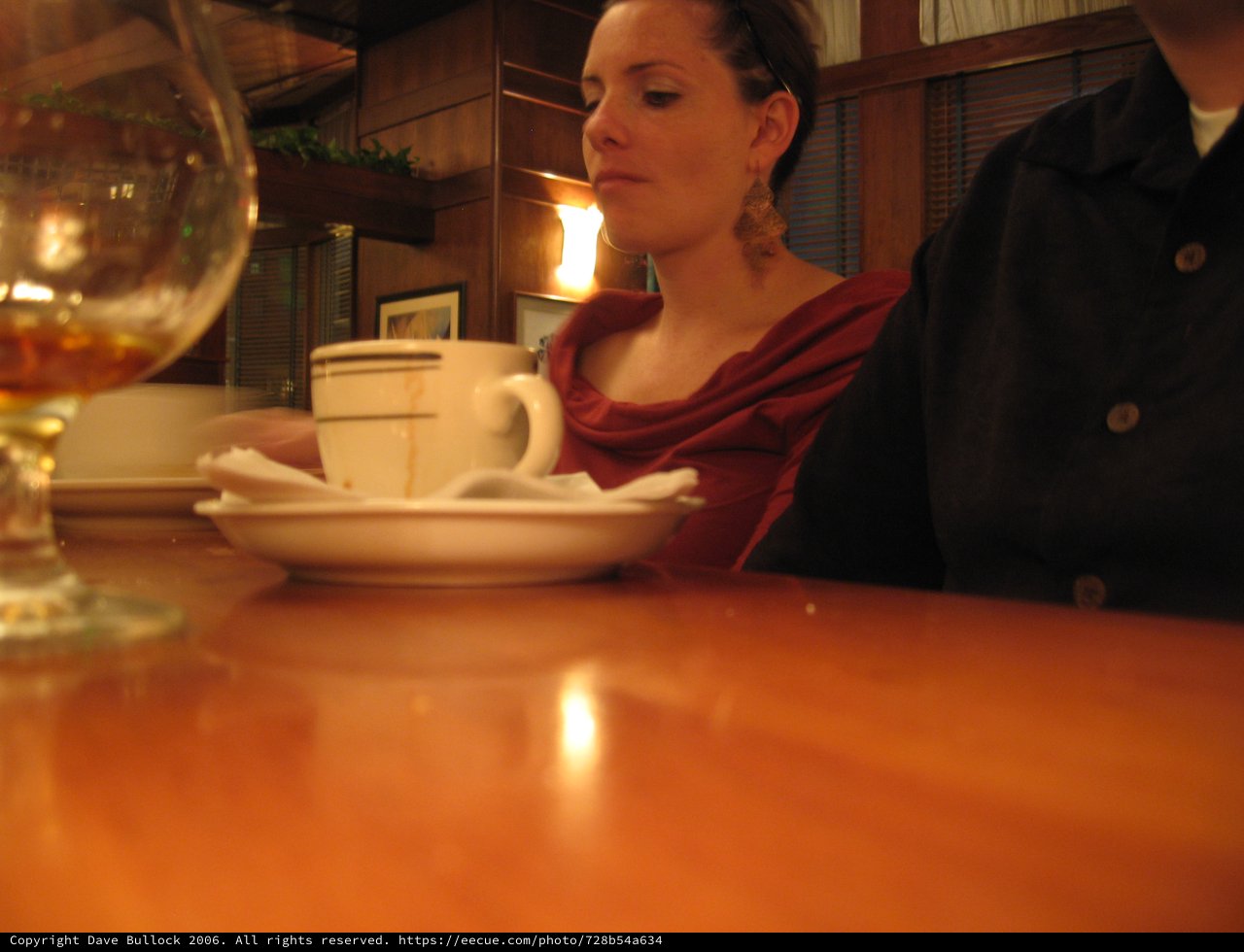 Quiet Contemplation Over Coffee at a Restaurant
