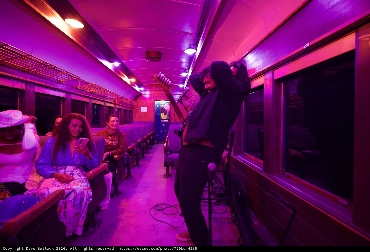 Purple-Lit Vintage Train Car Performance Space