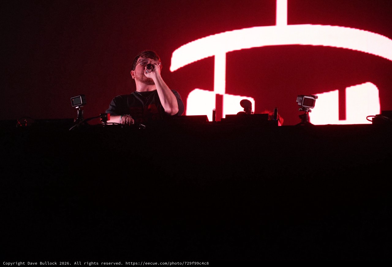 DJ Performs Under Red Glow at Wobbleland Festival