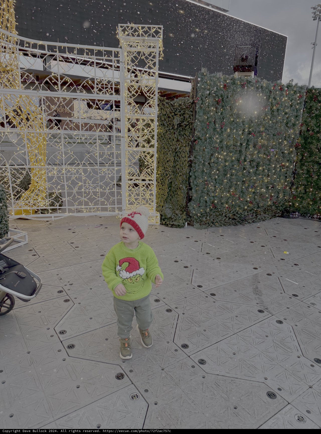 Toddler Explores Festive Holiday Display Setup