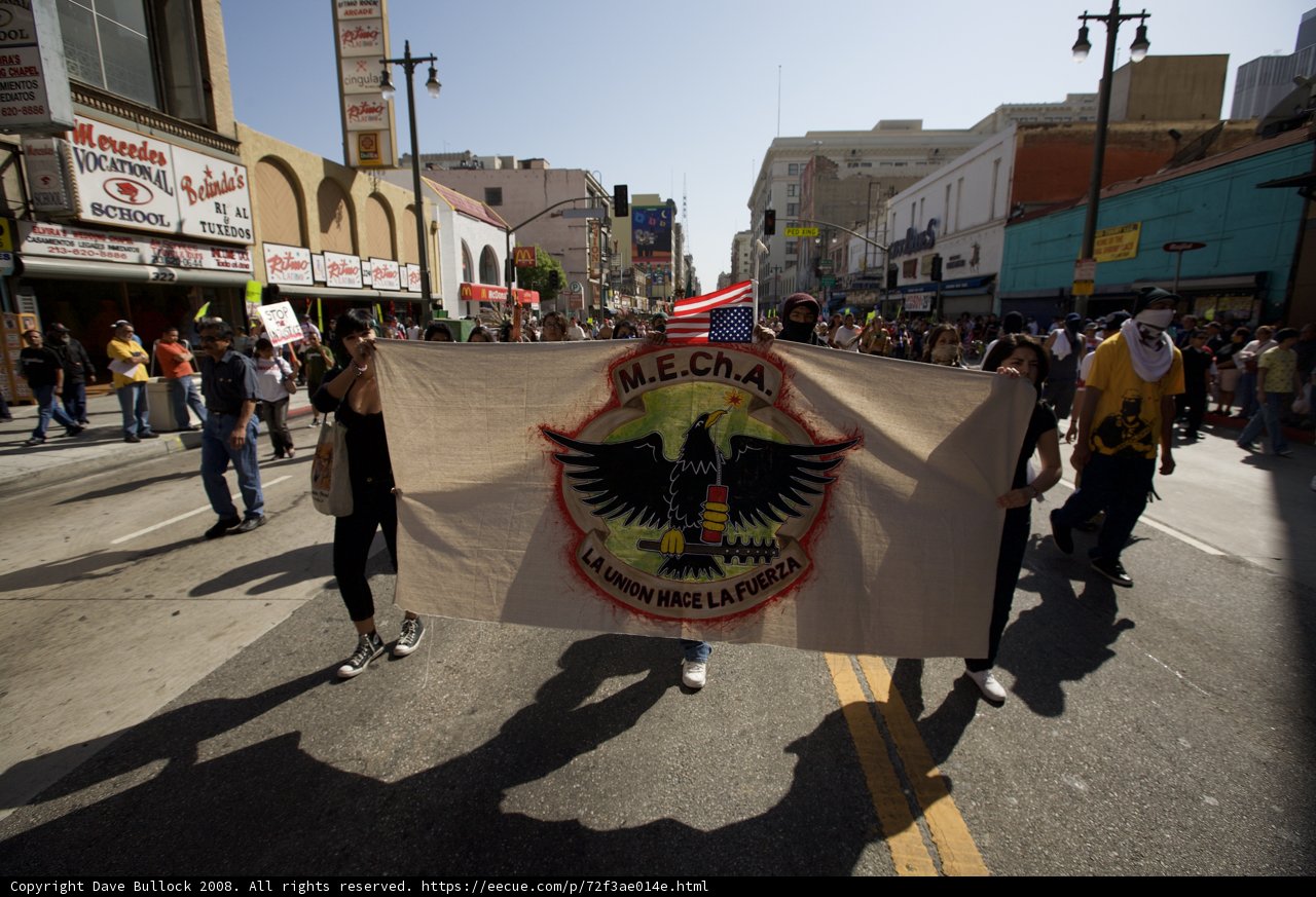 Mayday Rally Participants March with a Bold Banner