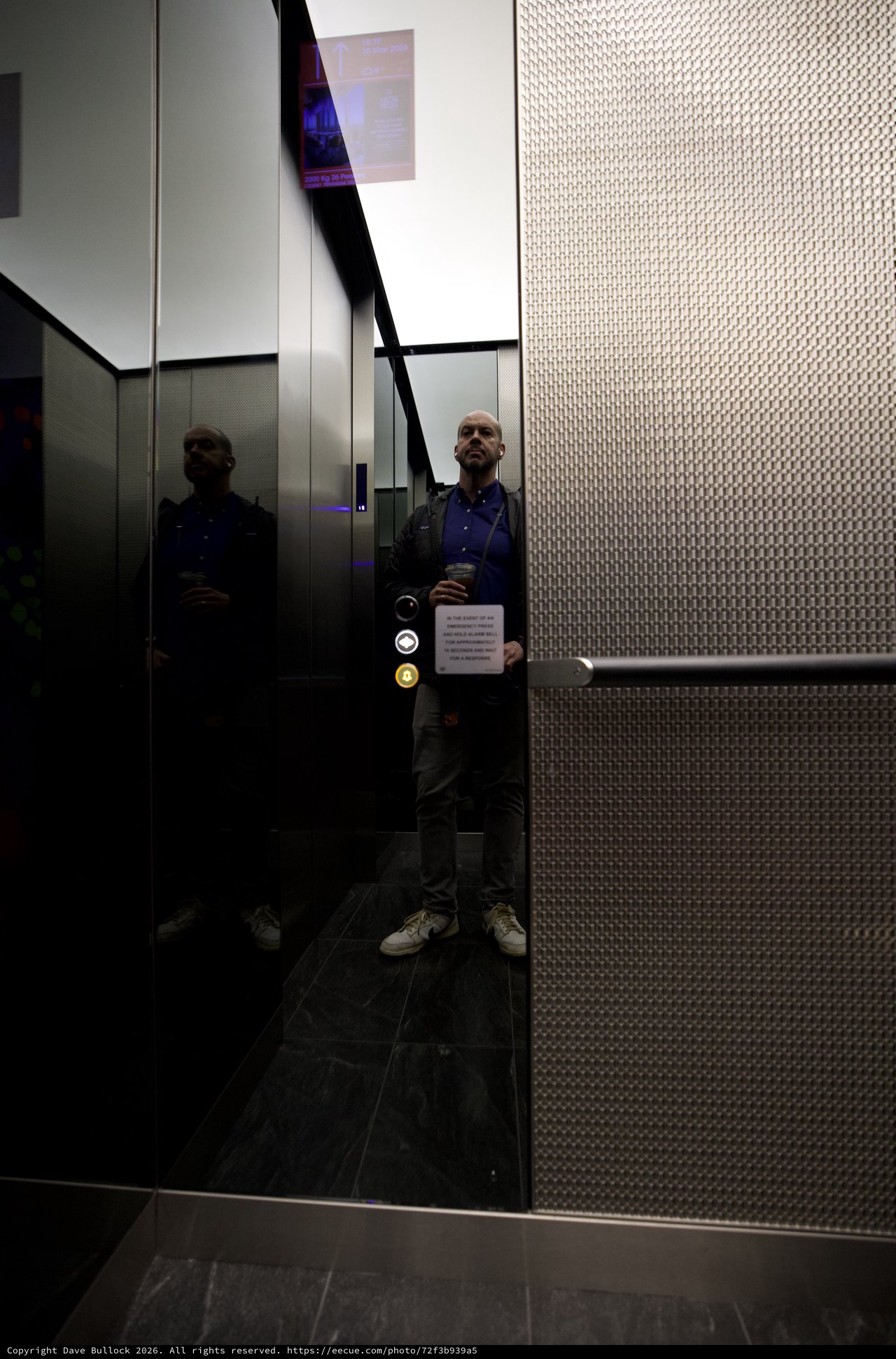 Reflective Self-Portrait in Modern London Elevator