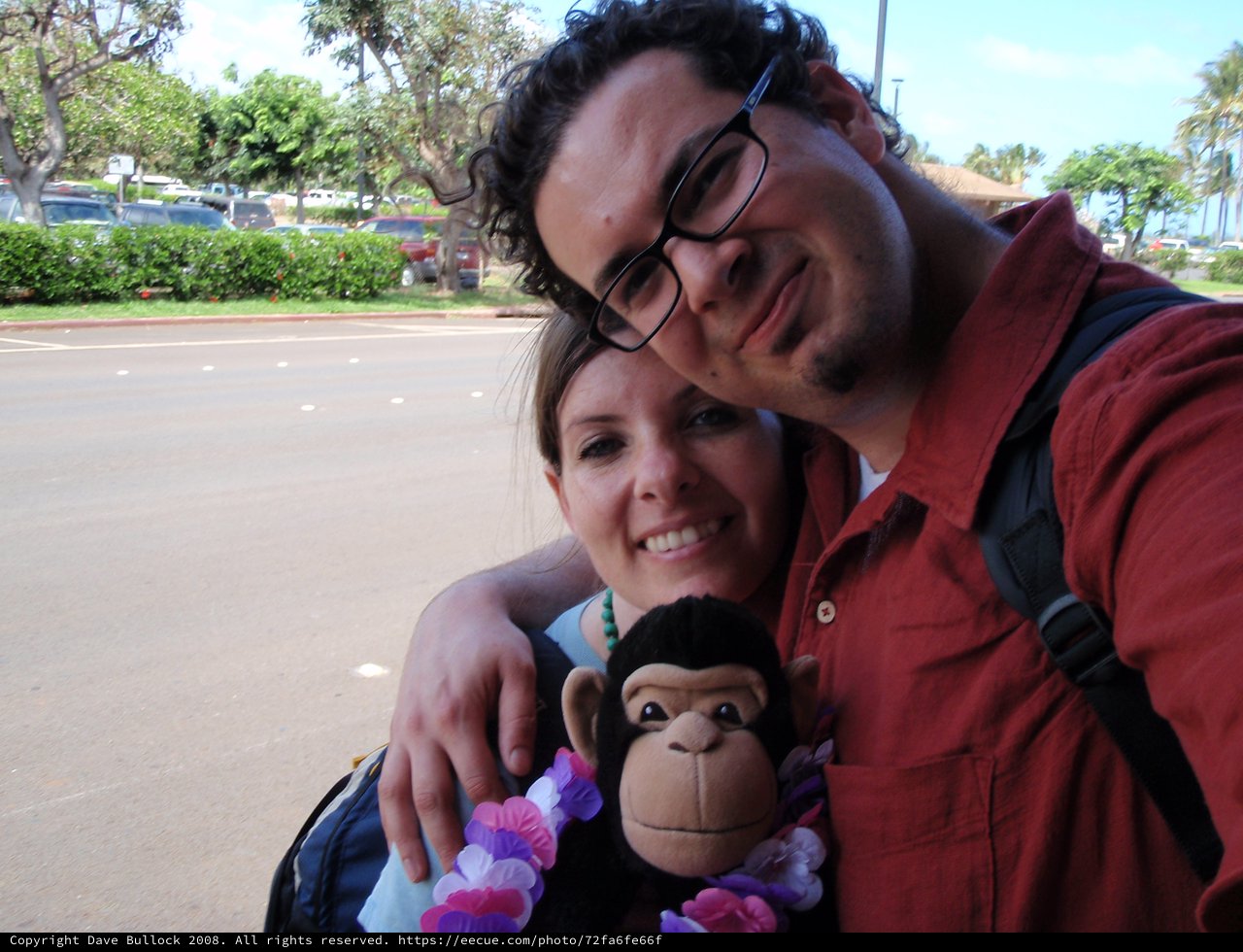 Couple with Monkey Toy at Hawaiian Parking Lot