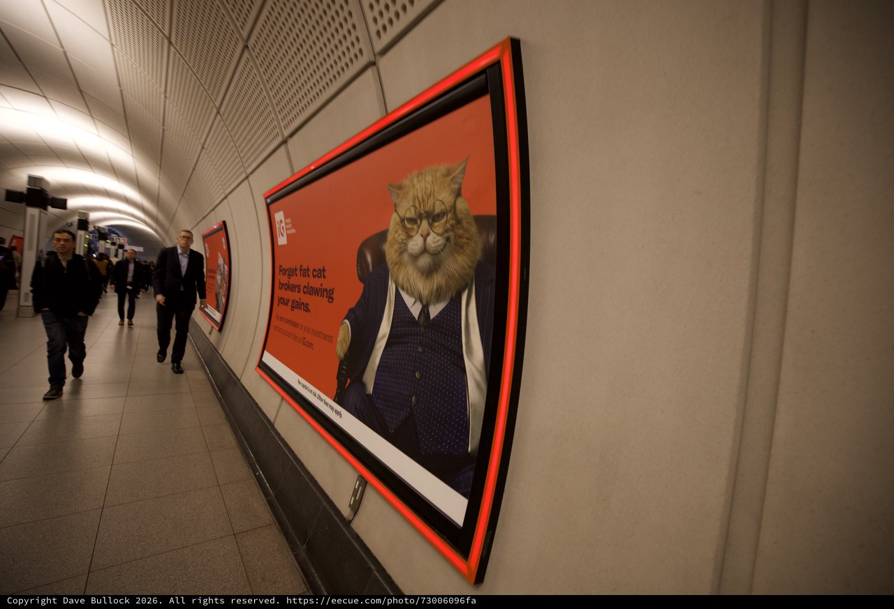 Surreal Cat-Headed Businessman Advertisement in London Underground
