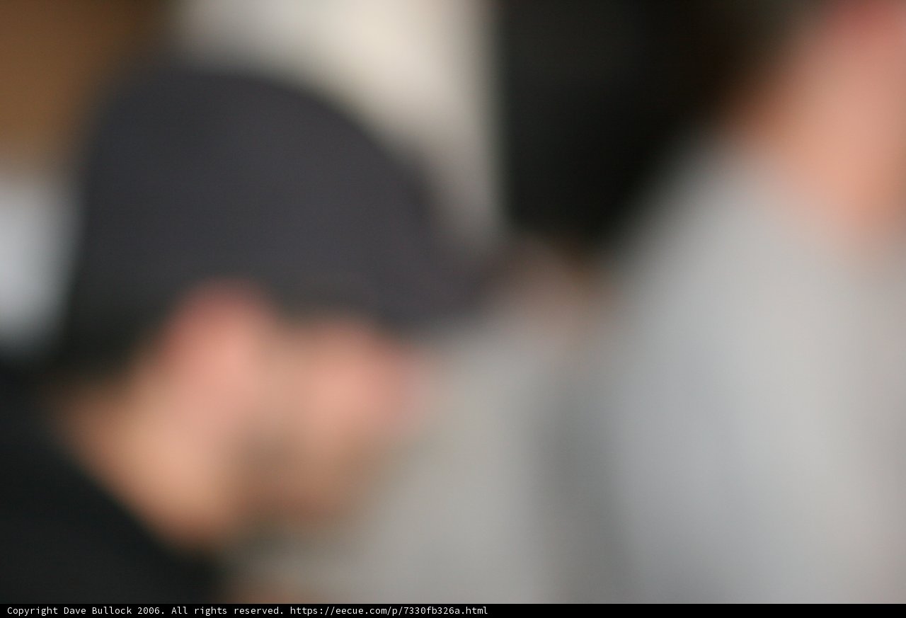 Blurry figure in a cap