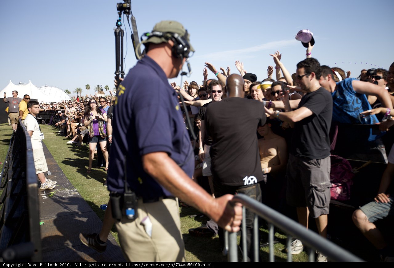 Man Standing Tall Amidst a Sea of People
