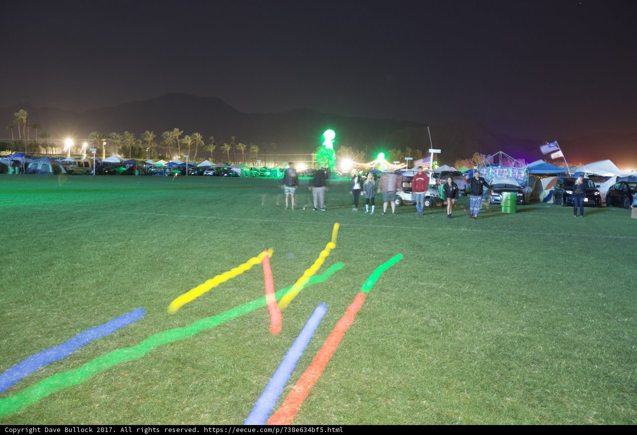 Nighttime Crowd in Grass Field