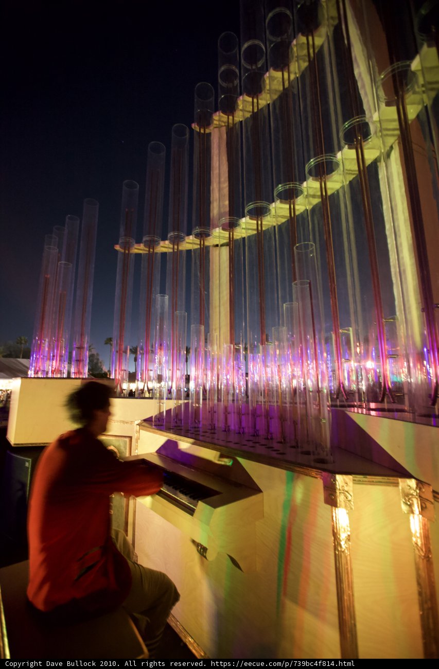 Piano Performance in Front of Illuminated Fountain