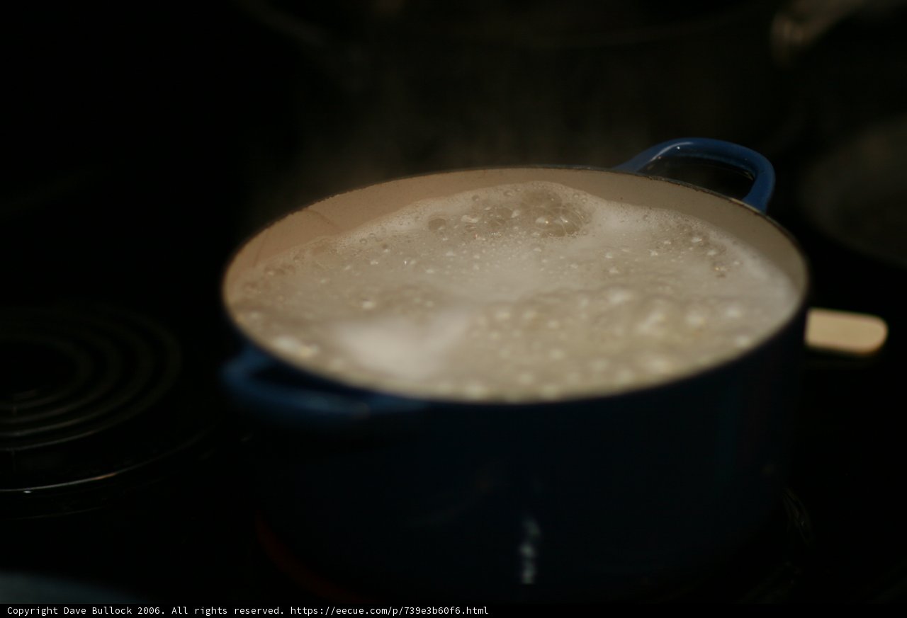 Boiling Cup of Coffee on a Stove