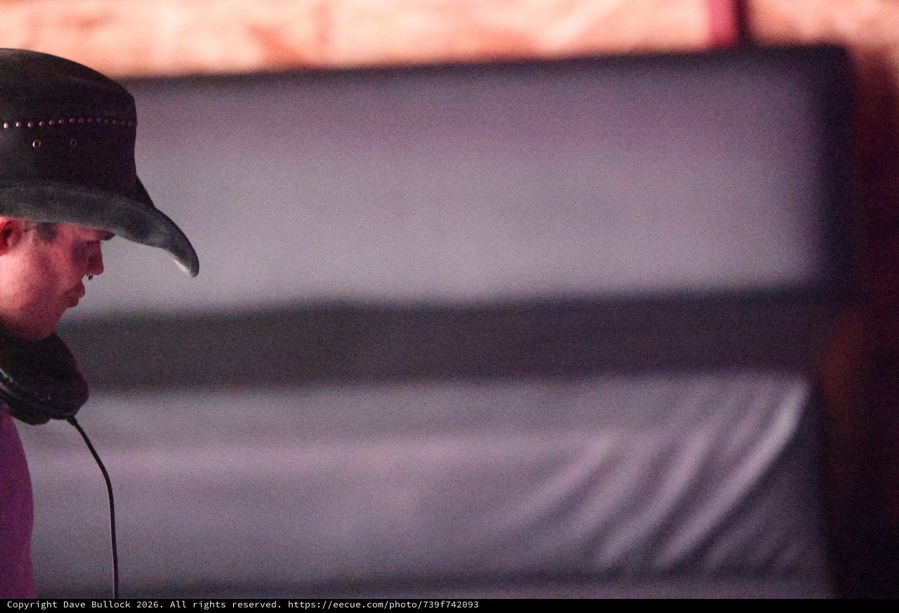 Cowboy Hat DJ in Brooding Stage Shadows