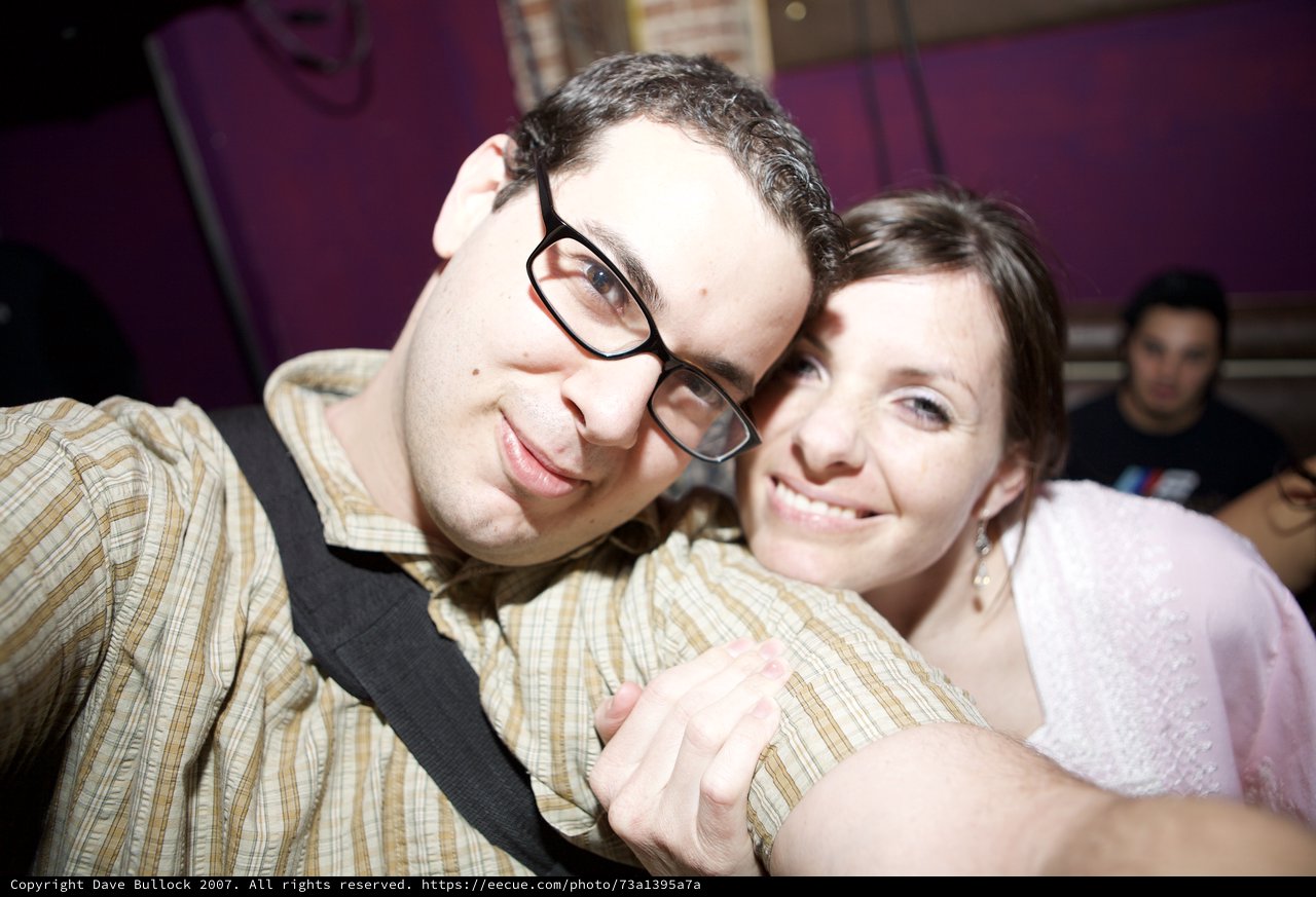 Couple Shares Joyful Moment at Nightclub Event