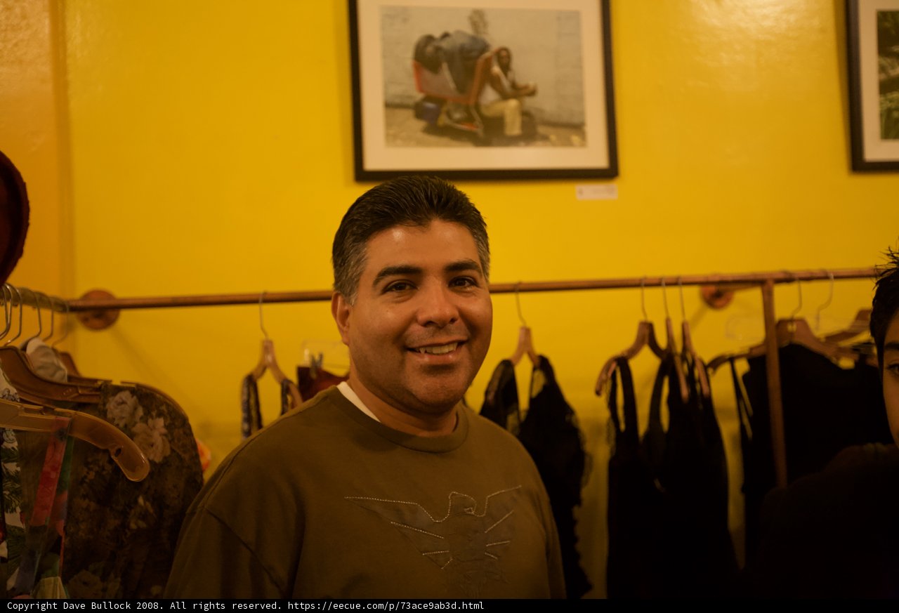 Tony Cardenas Smiling in Front of Clothing Rack