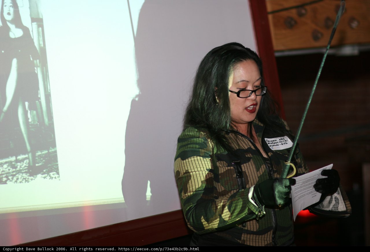 Camouflaged Woman with Knife and Projector Screen
