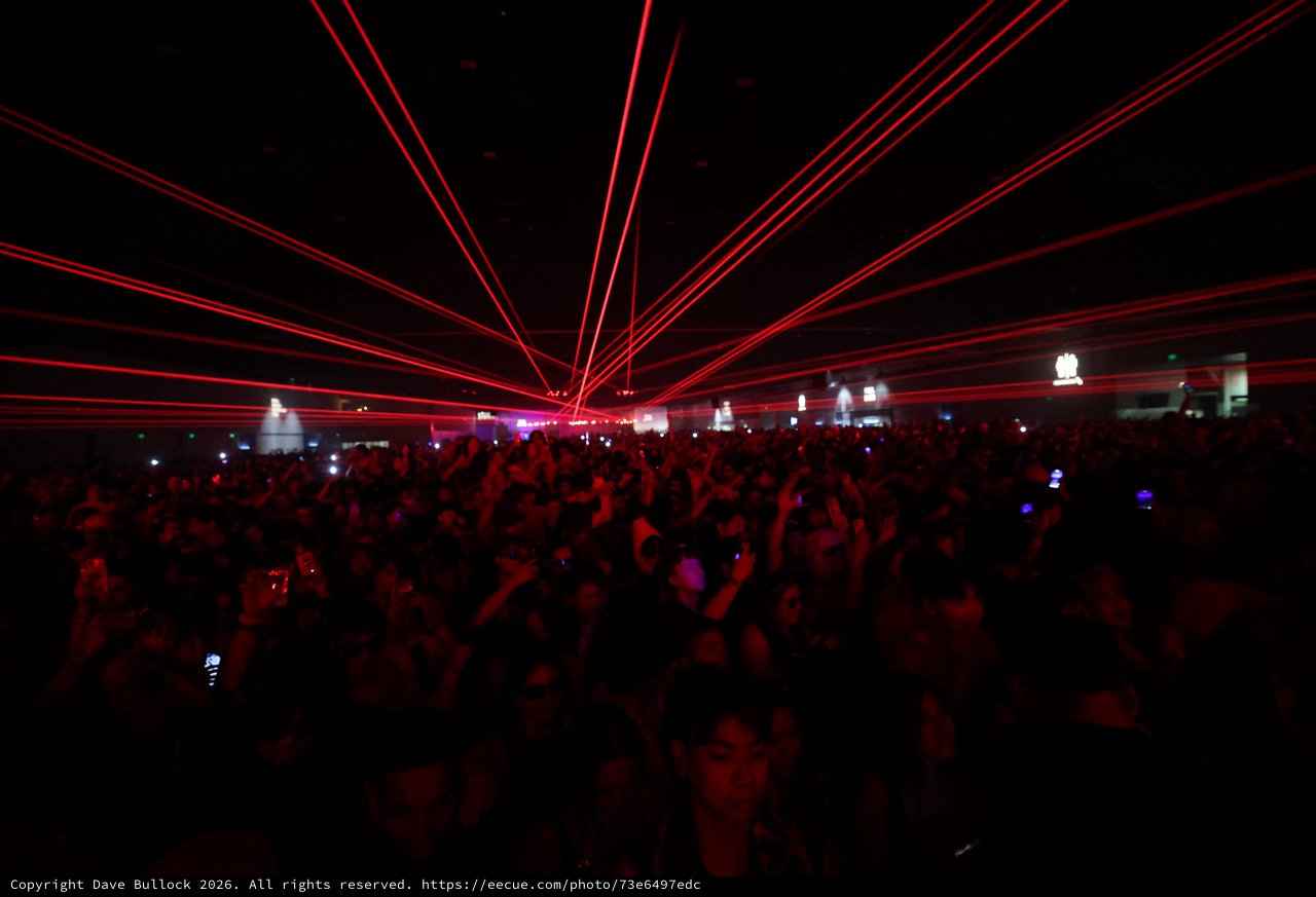 Red Laser Storm Over Massive EDM Festival Crowd