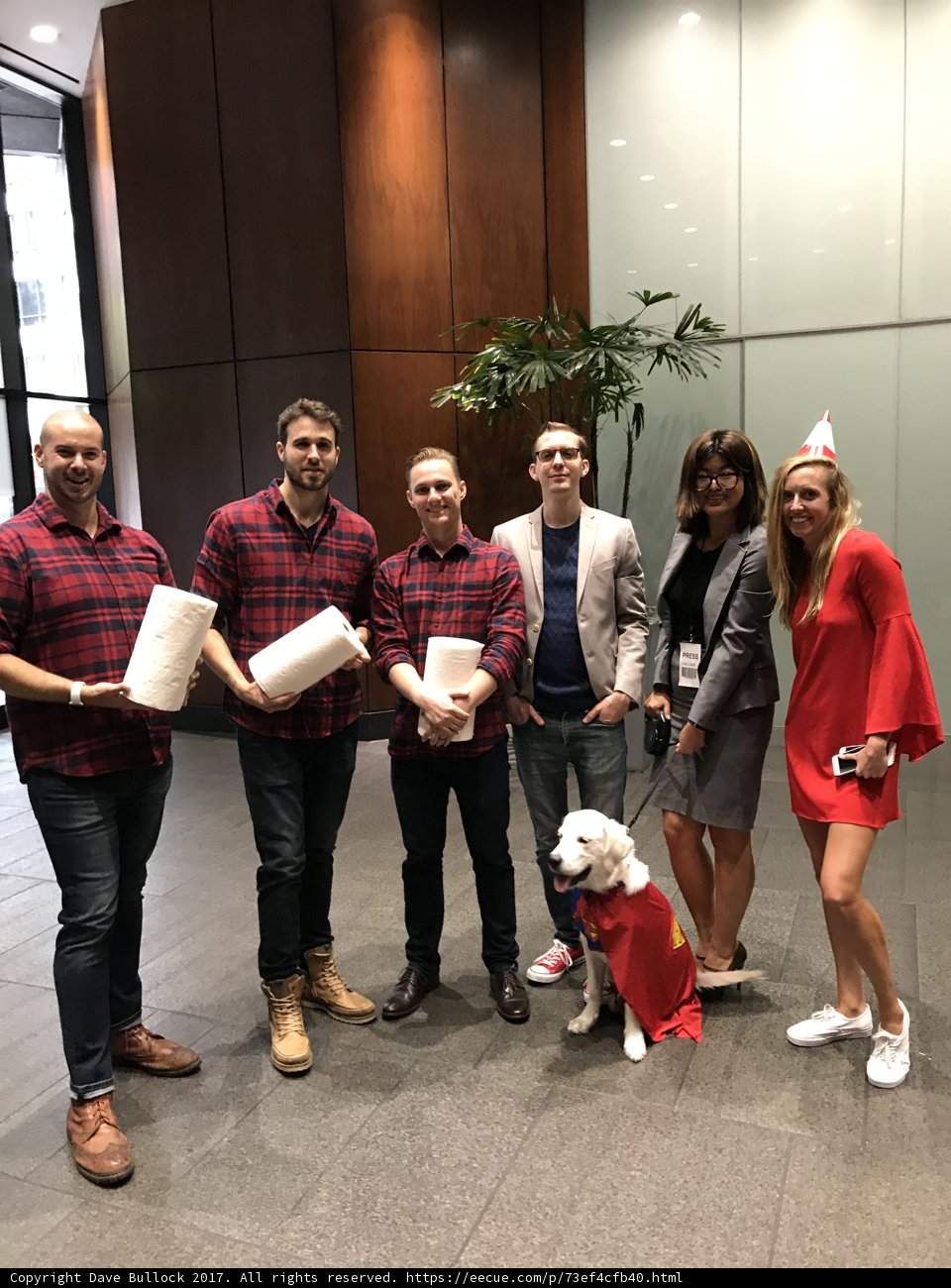Red-Shirts Posed with their Furry Friend