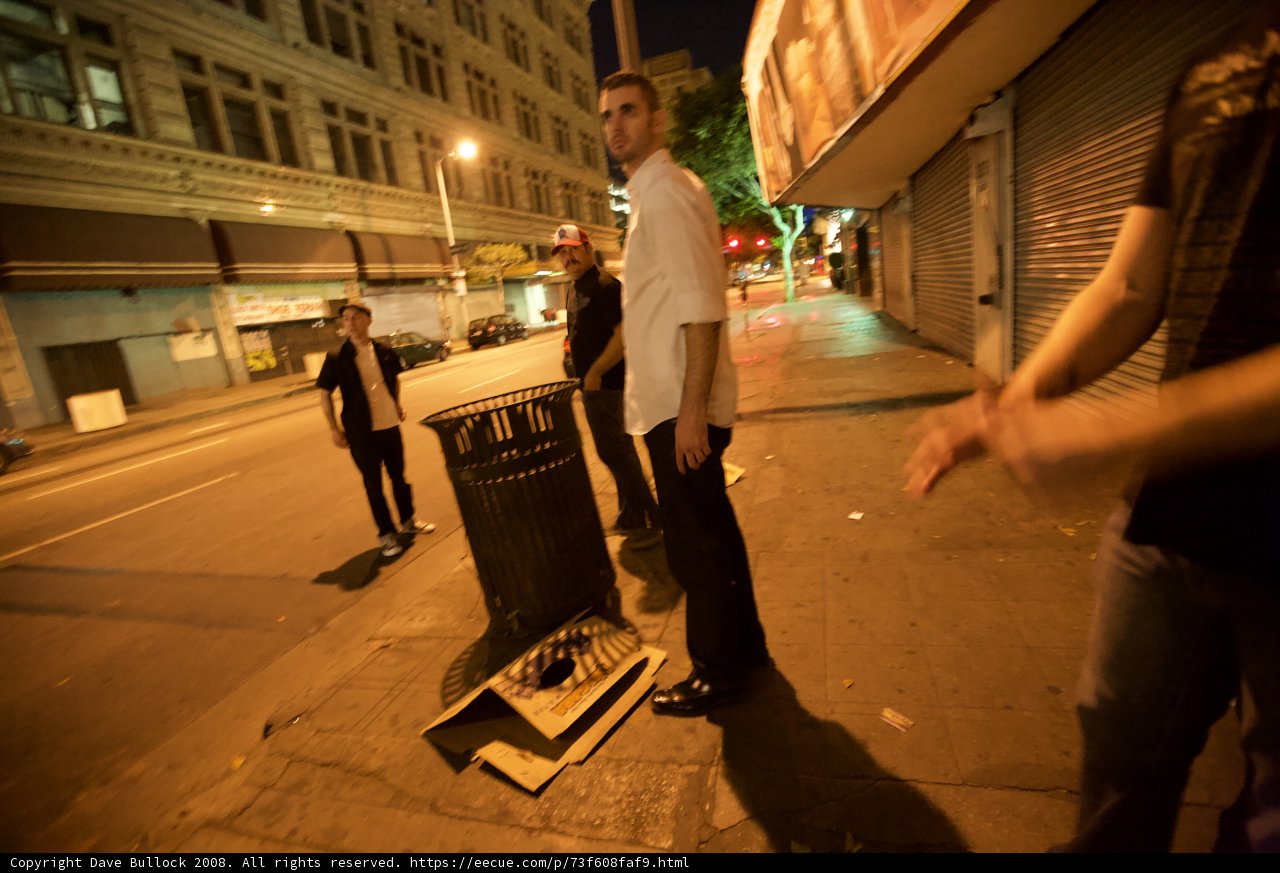 Man and Trash Can on Urban Street