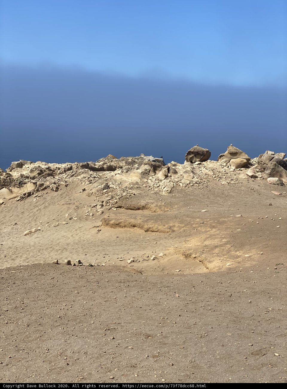 Sole Adventurer amidst a Rocky Wilderness