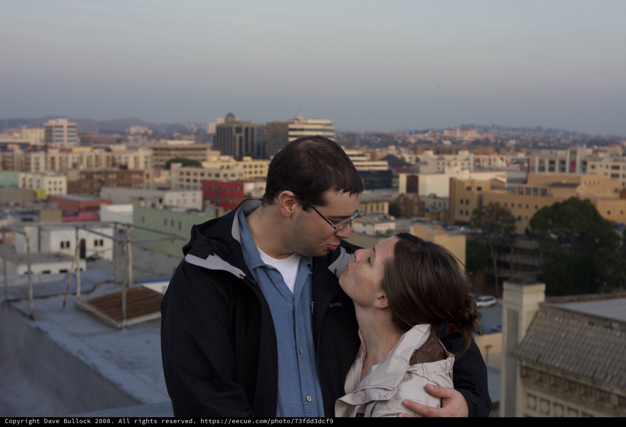 Rooftop Kiss at Dusk Over the City
