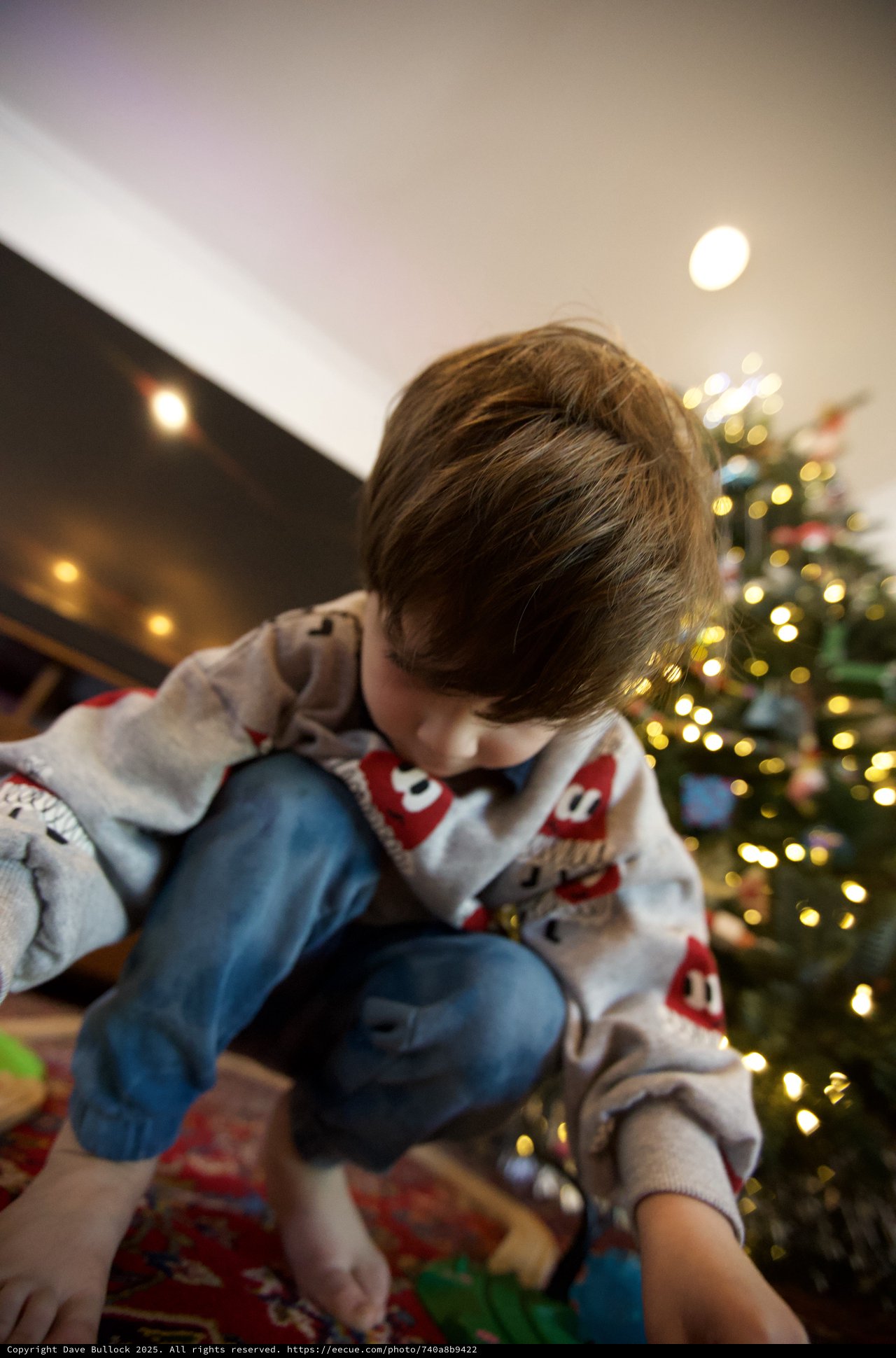Child Opening Presents on Christmas Morning
