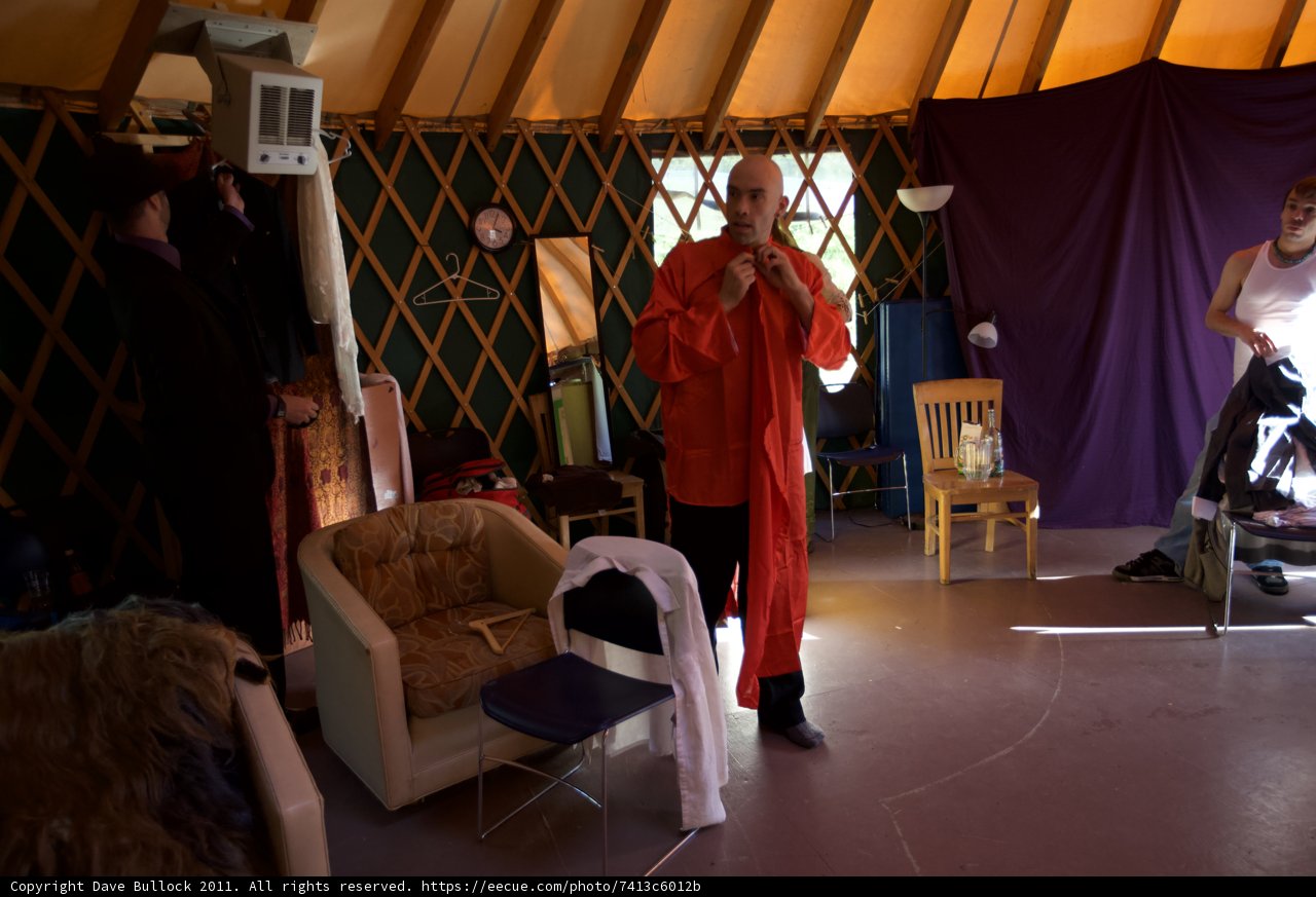 Red Robed Man in a Lavish Living Room