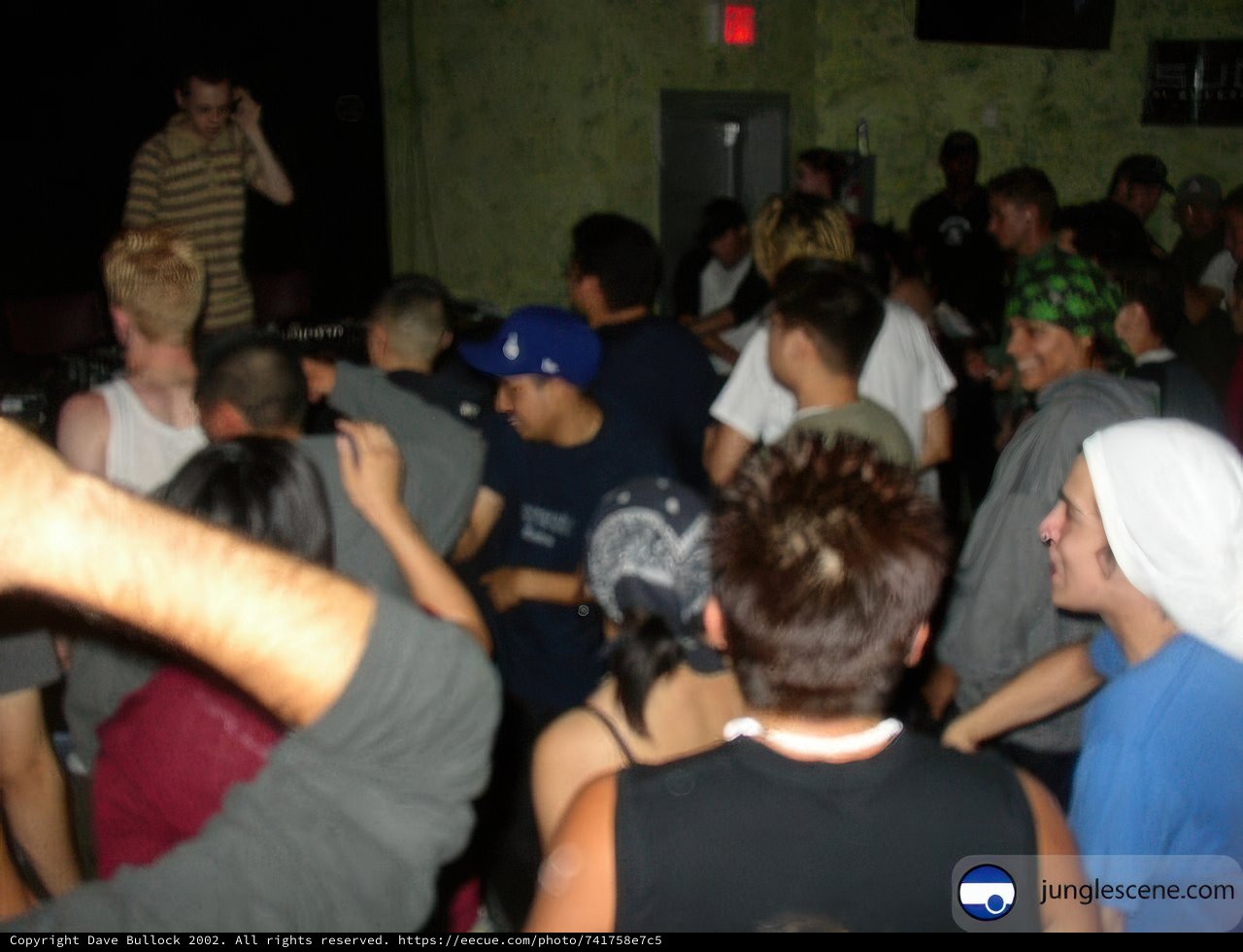 Nightclub Party with Man in a Hat