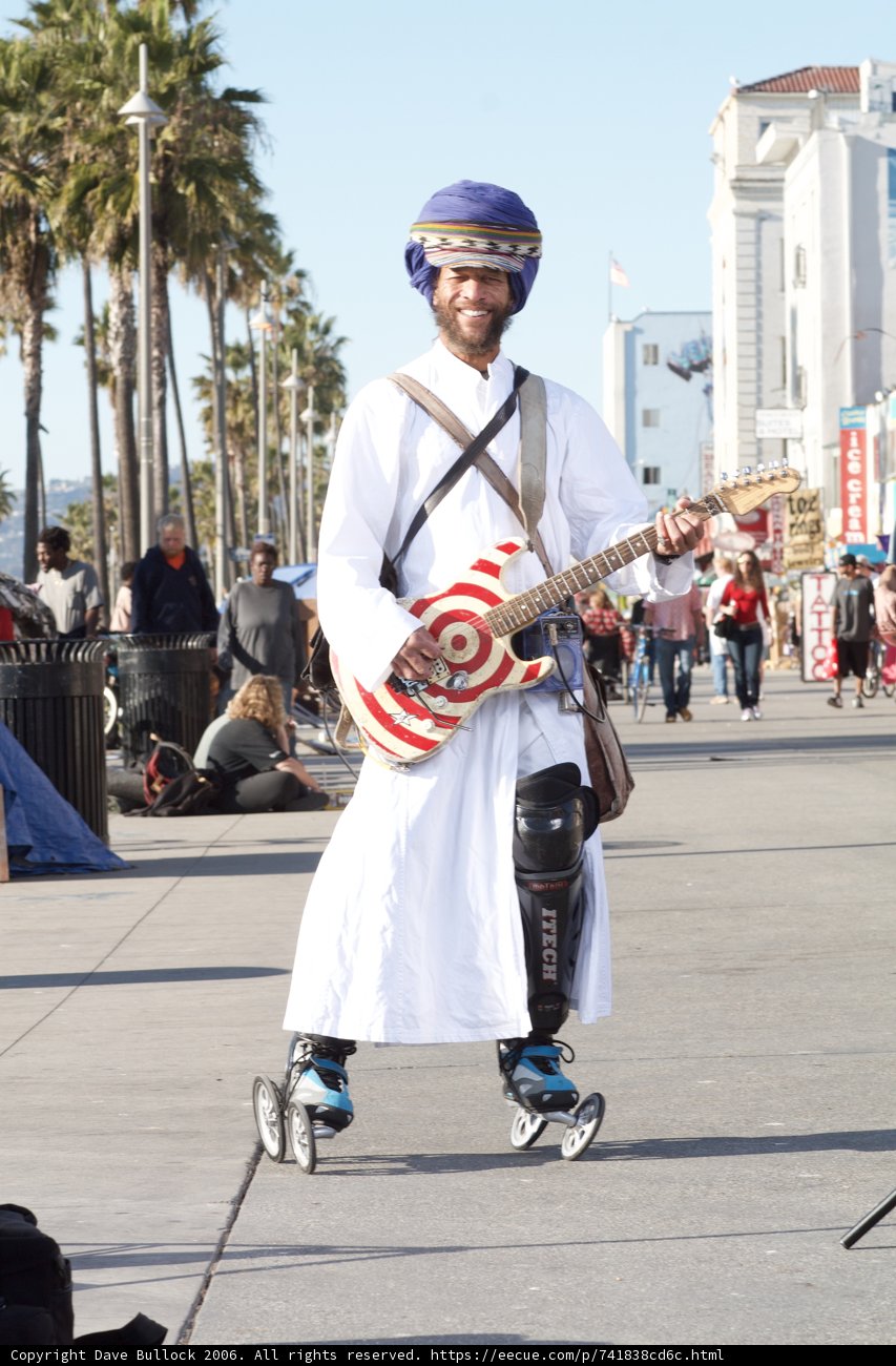 Musician playing guitar in an outdoor concert