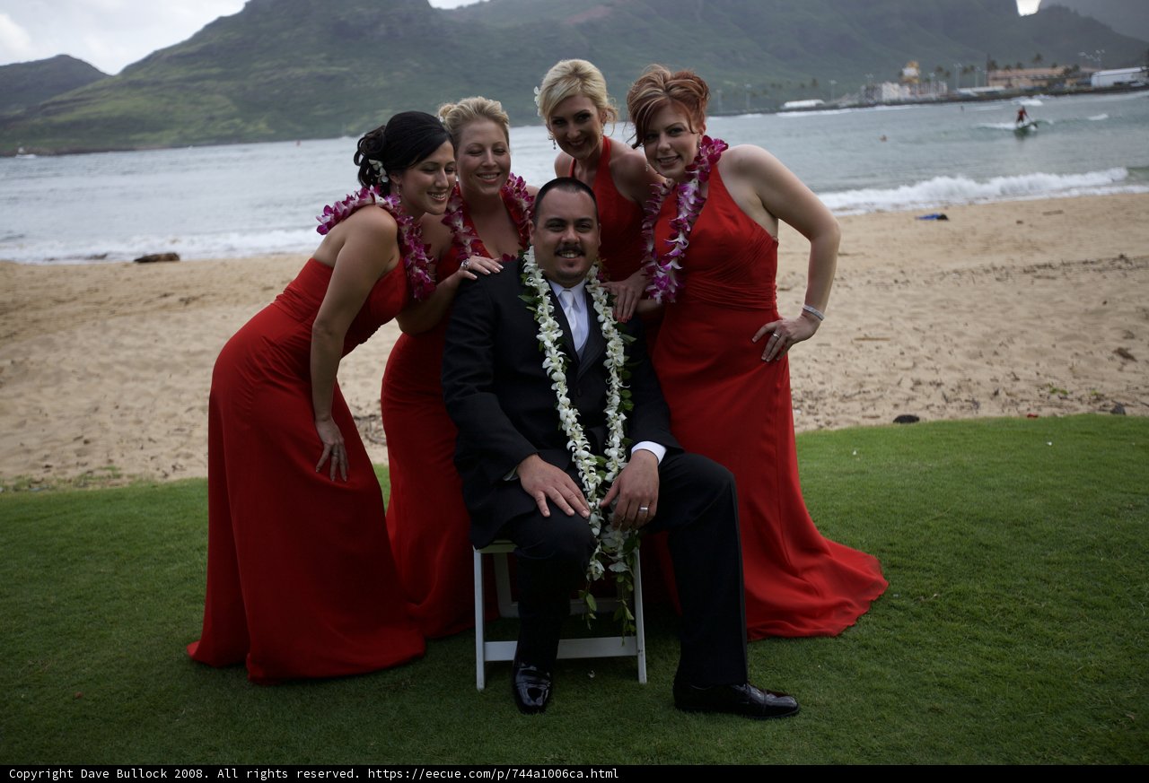 Red Suited Man and Four Women Strike a Pose
