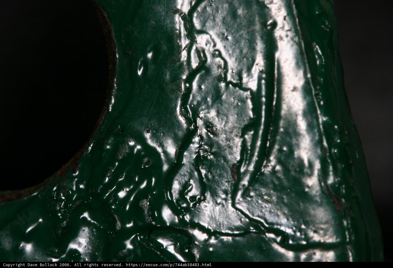Green Metal Sculpture with a Mysterious Hole