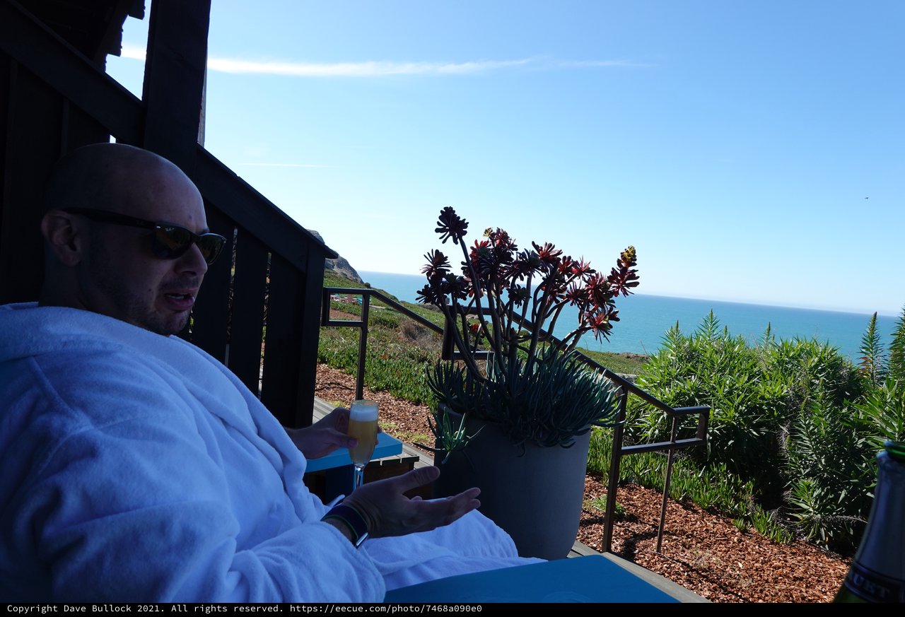 Relaxing oceanside morning in white robe