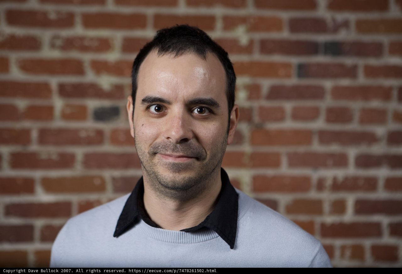 Happy Man Against the Brick Wall