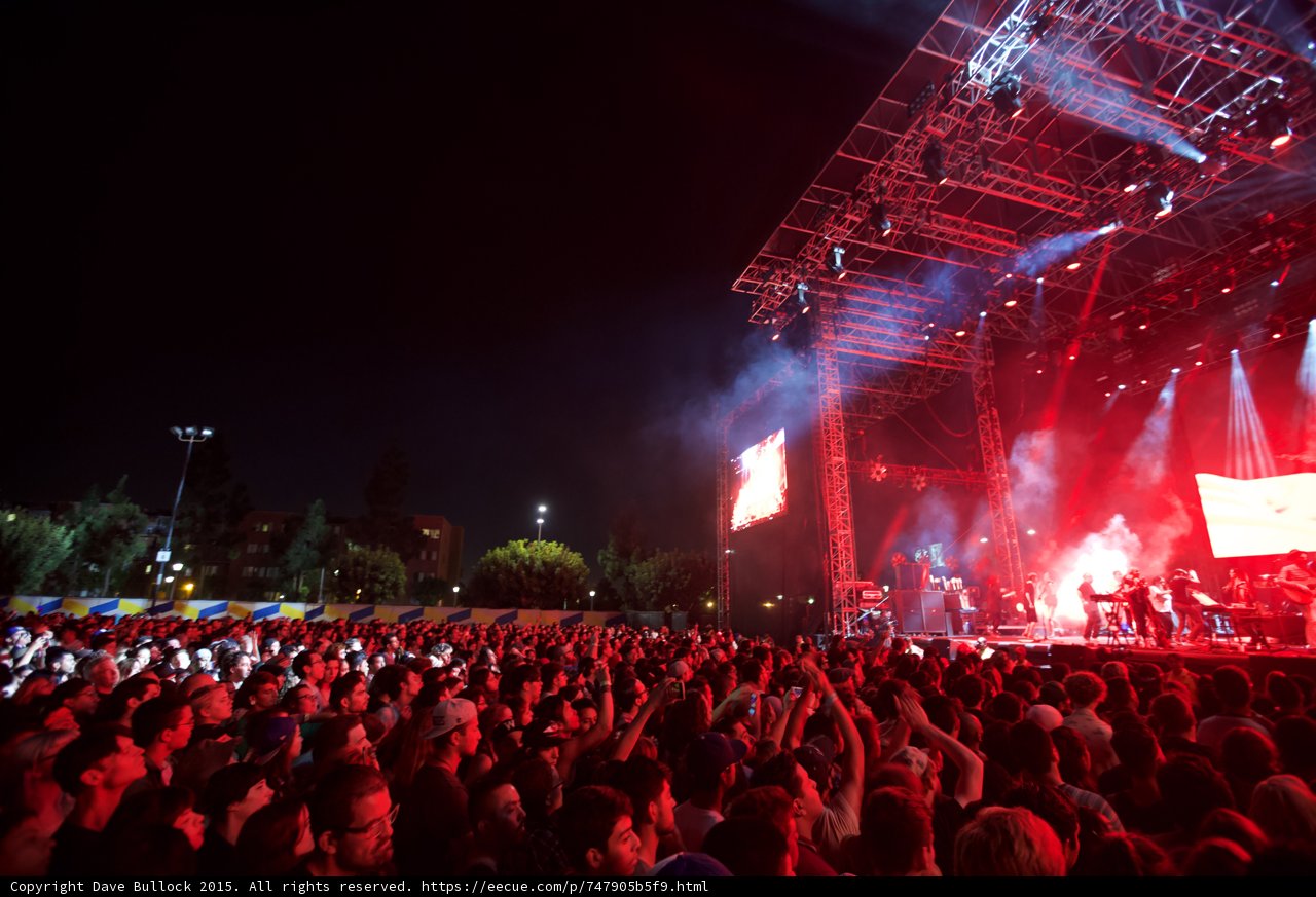 FYF Fest Wide Crowd Stage Red Lighting Pyro Smoke Trees Buildings Arms Raised Night