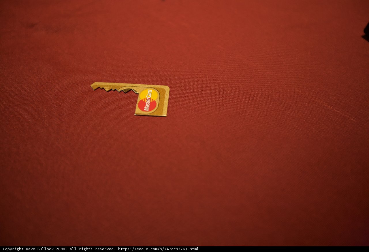 Golden logo pin on red cloth