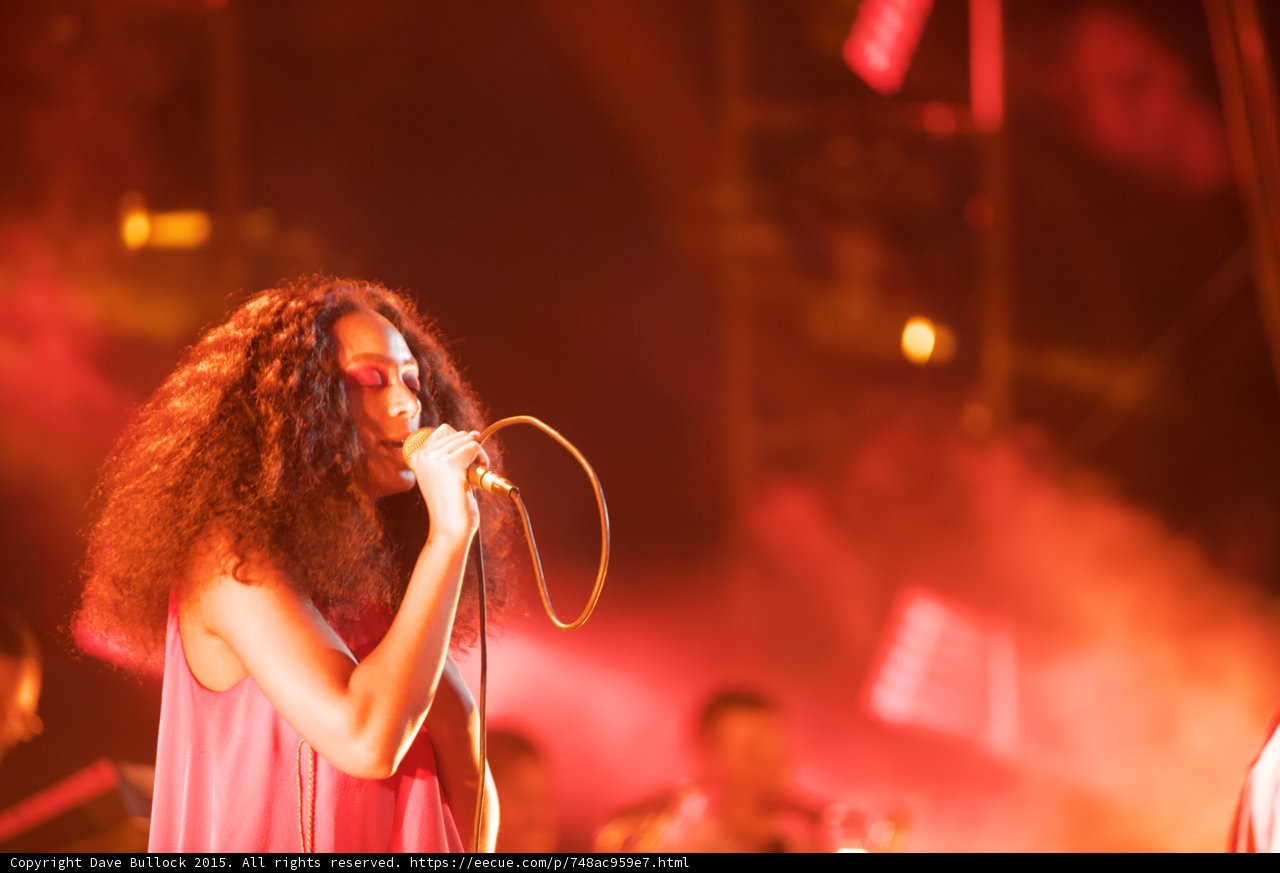 Solange Portrait Eyes Closed Band Spotlight Red Orange Pink