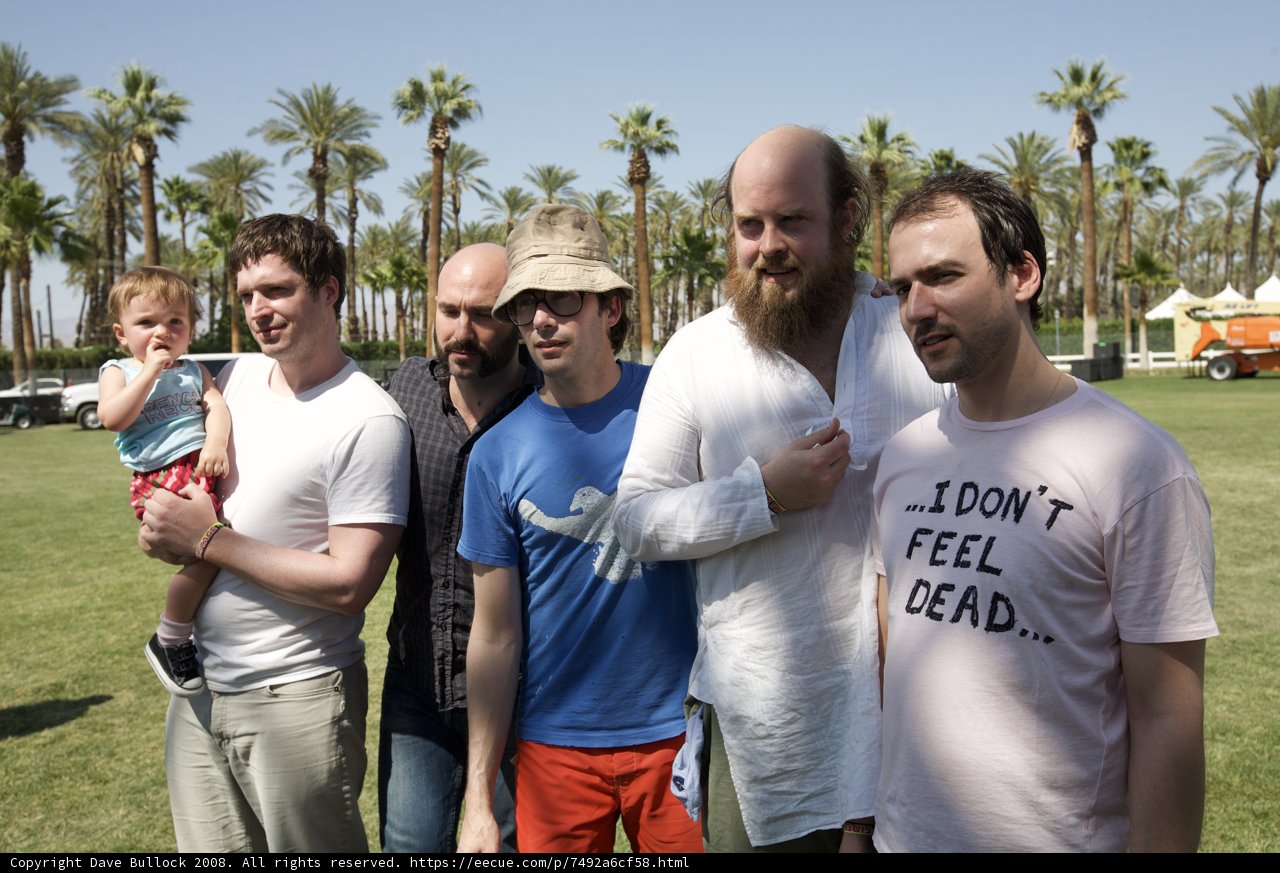 Group of Men Enjoying Coachella in the Park