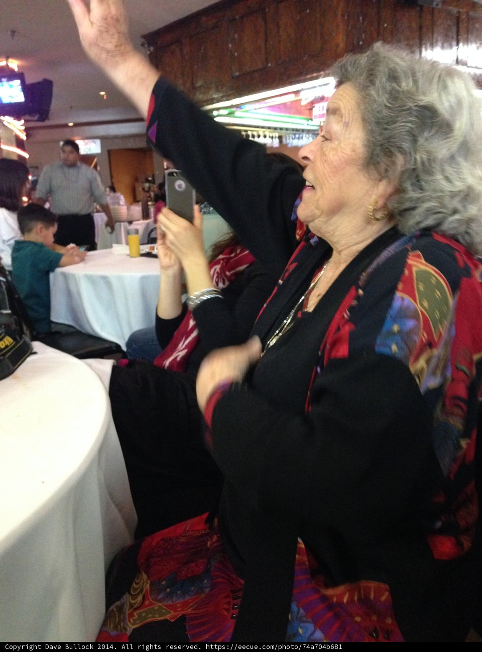Hands Up in a Formal Dining Setting