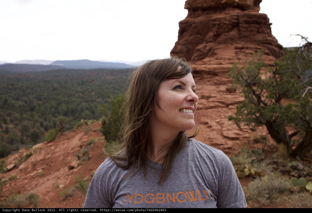 Woman Smiling Atop Sedona Red Rock Formation