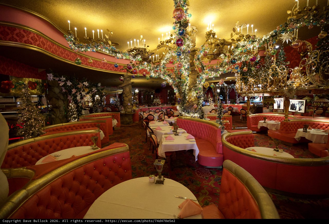Lavish Christmas Decorated Restaurant Interior with Ornate Chandeliers
