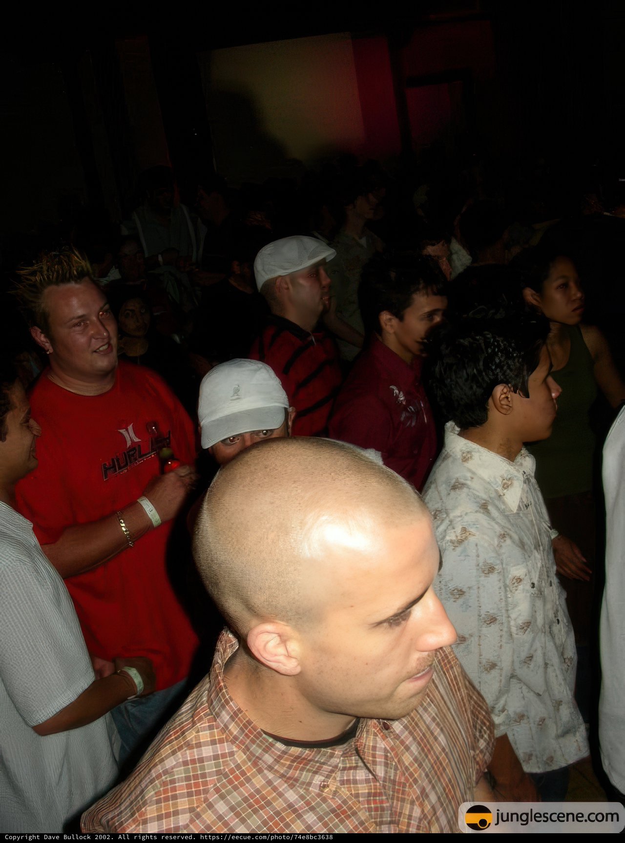 Bald-Headed Man Draws a Crowd at Nightclub
