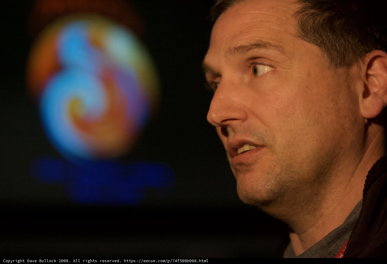 Man Gazing at Mars Lander Log on Screen