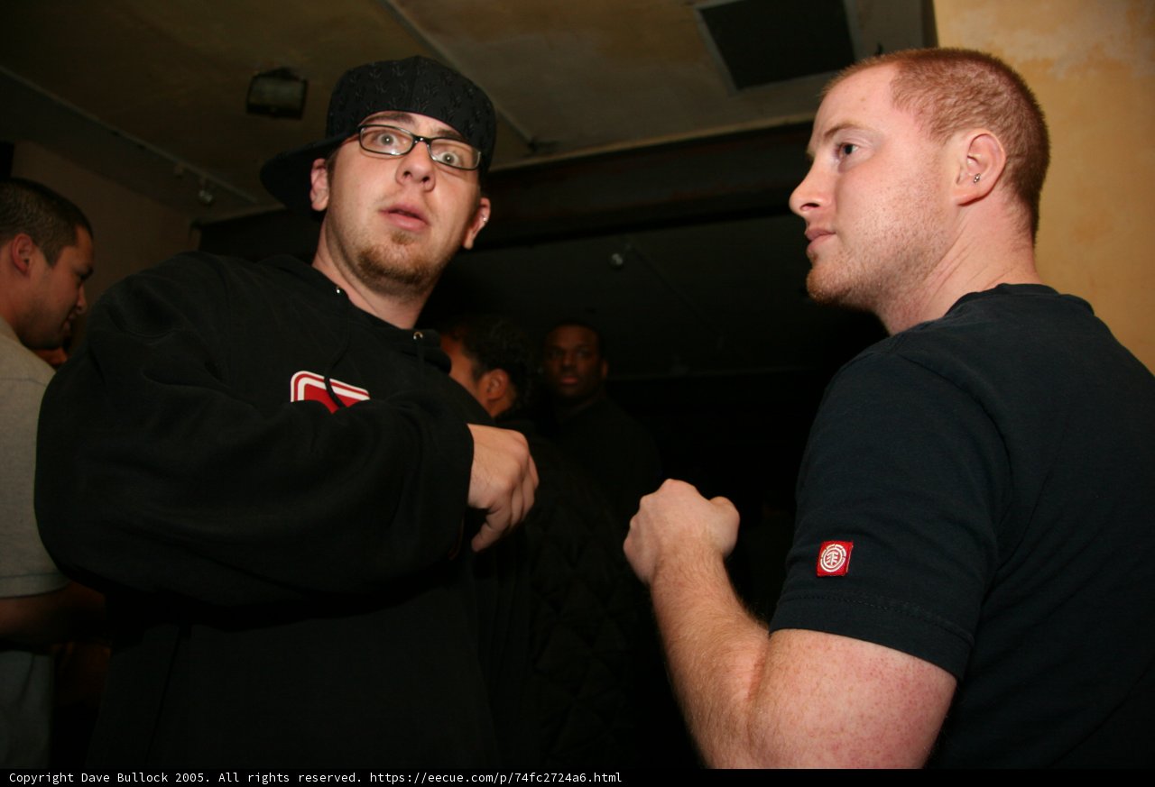 Man in Black Shirt and Baseball Cap