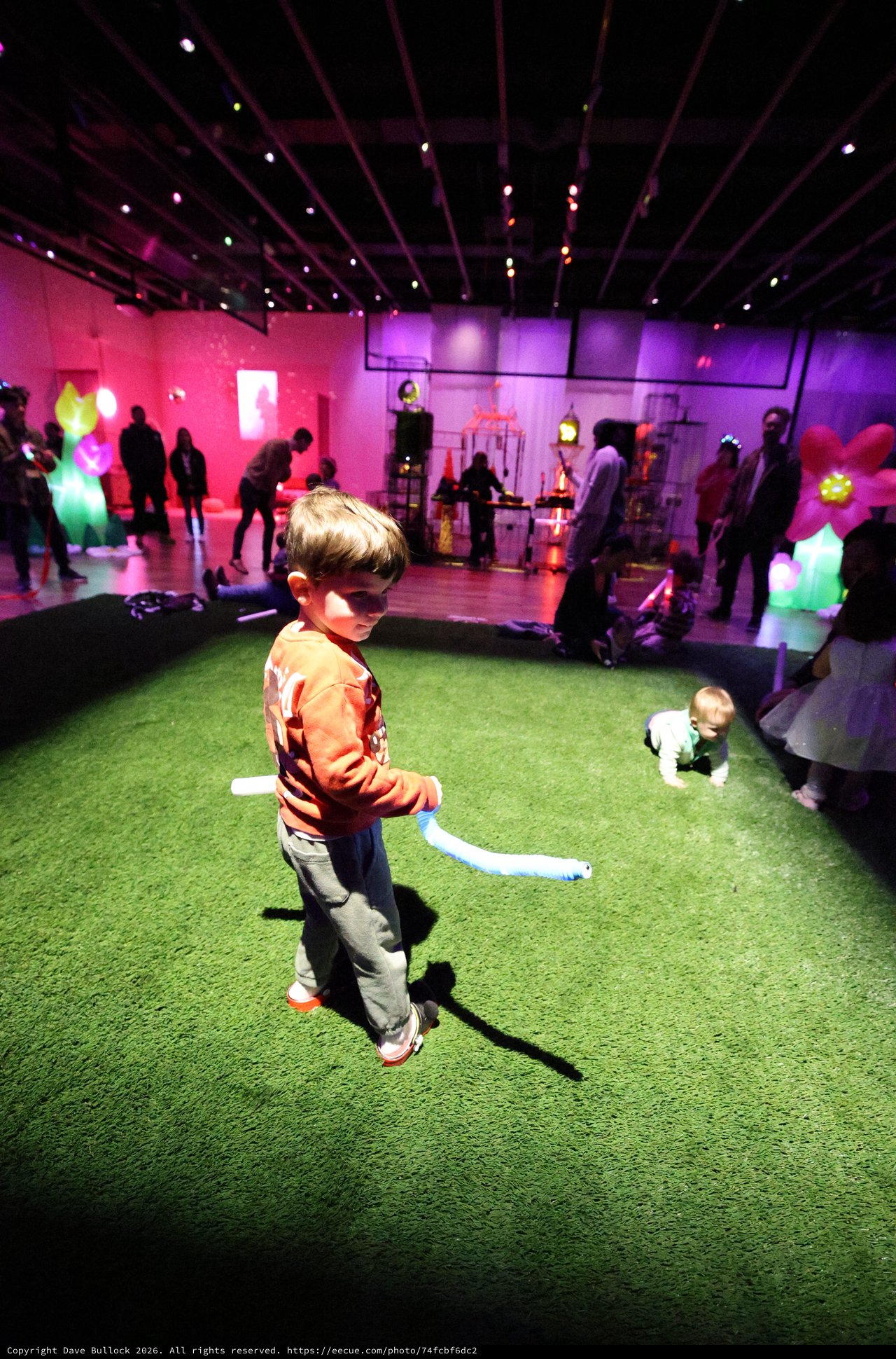 Child Dancing at Colorful Baby Rave Art Installation