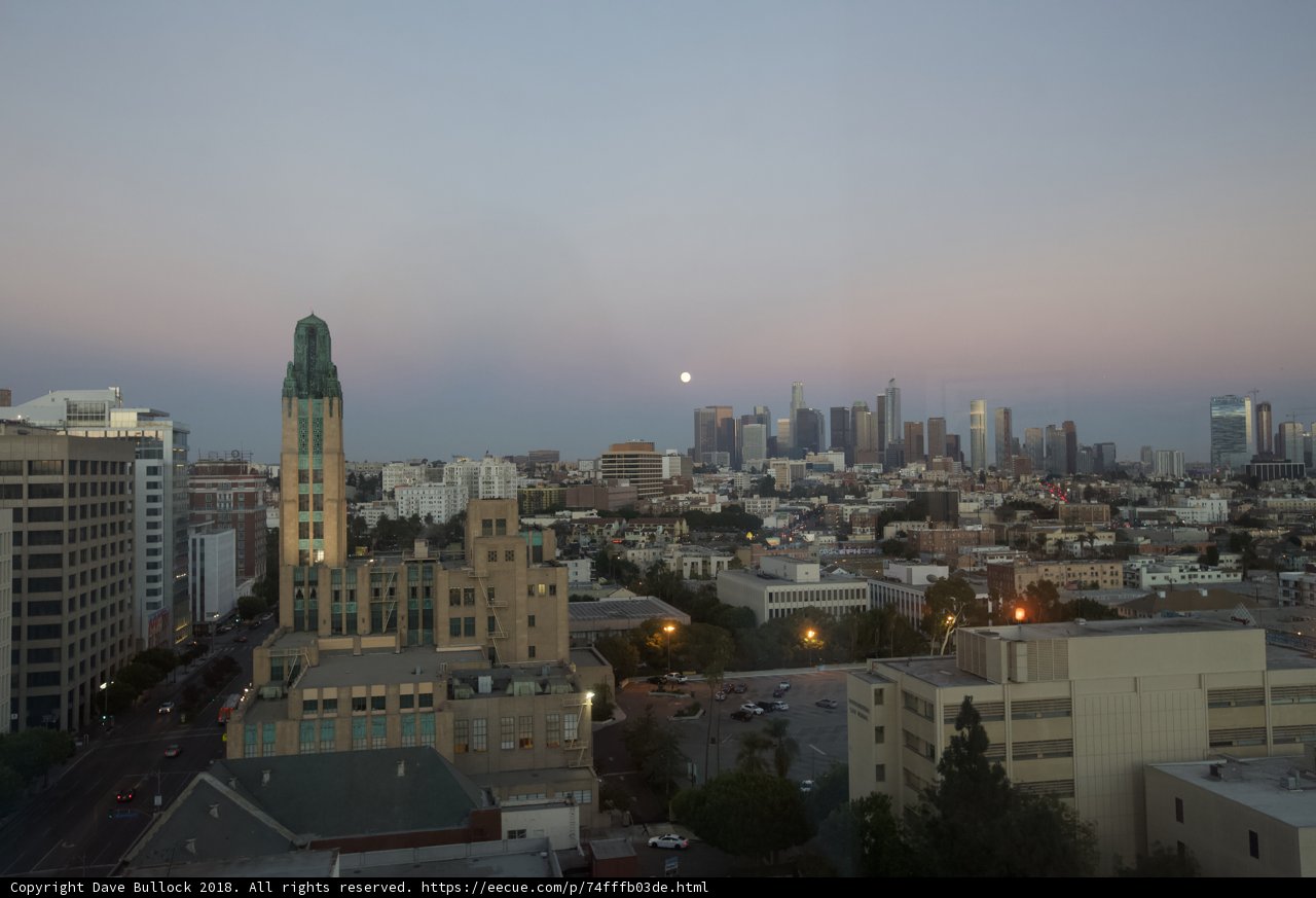 Moonrise Over the Urban Skyline