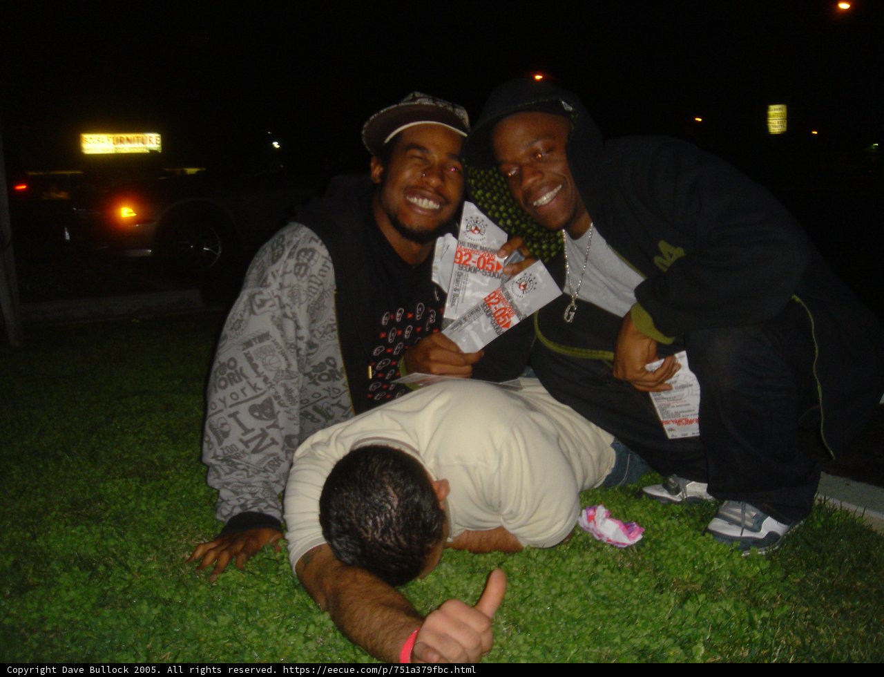 Three Men Enjoying a Night Out on the Grass