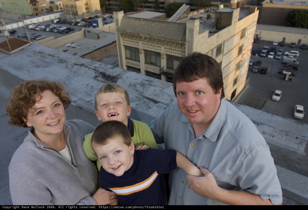 Family Portrait on Urban Rooftop at Dusk